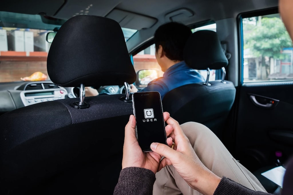 Person Using A Phone in backseat